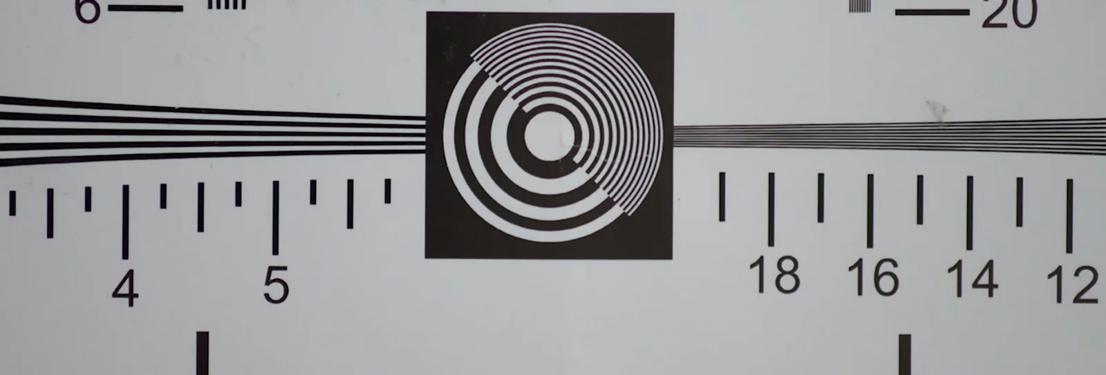 The same resolution test chart photographed through a Kolari Shades Ultra lens, showing crisp, high contrast detail