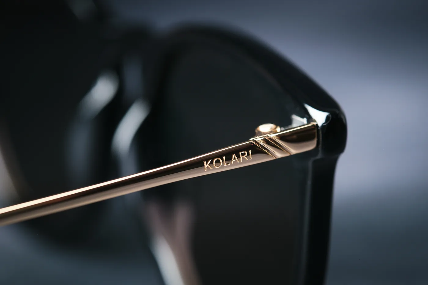 Macro detail of the titanium temple and lens edge on a Kolari Shades frame